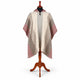 Cream and burgundy striped hooded poncho on a mannequin, front