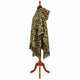 Sage and rust camo alpaca wool poncho – side profile on a mannequin showing the hood and drape over the arm