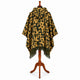 Gold and olive camo alpaca wool poncho – back view on a mannequin showing the hood and full-width camouflage pattern