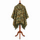 Sage and rust camo alpaca wool poncho – back view on a mannequin showing the hood and full-width camouflage pattern