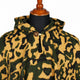 Gold and olive camo alpaca wool poncho – close-up of the neckline with wooden button and loop closure and the woven texture