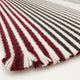 Short natural hem of the cream and burgundy striped poncho