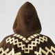 Clint Eastwood alpaca wool poncho – brown hooded poncho displaying white geometric patterns, viewed from the back, against a plain gray background
