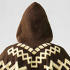 Brown hooded garment displaying white geometric patterns, viewed from the back, against a plain gray background.