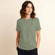 Woman wearing 100% organic cotton premium unisex t-shirt, soft cotton blend, fair trade, Paramo Green logo sage green