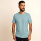 Man wearing 100% organic cotton premium unisex t-shirt, soft cotton blend, fair trade, Andean Sky plain sky blue