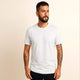 Man wearing 100% organic cotton premium unisex t-shirt, soft cotton blend, fair trade inspired, plain white