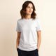 Woman wearing 100% organic cotton premium unisex t-shirt, soft cotton blend, fair trade inspired, plain white