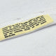 Text label on a white fabric background