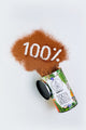 Cacao powder forming the number ‘100%’ next to open KAMM container