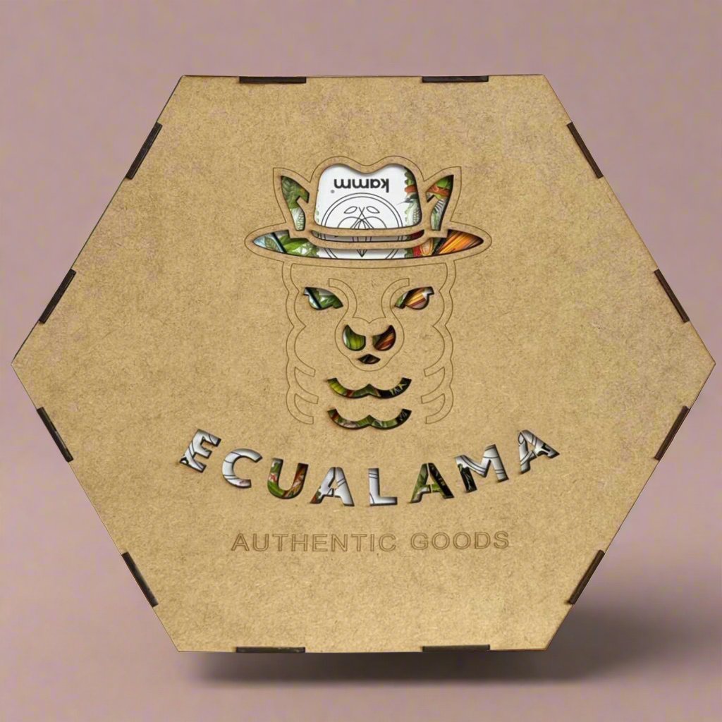 Hexagonal wooden box featuring a carved llama face with a hat. The text Ecualama and AUTHENTIC GOODS is cut out, revealing colorful designs beneath.