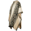 A cream-colored poncho drapes over a mannequin, featuring intricate geometric patterns in dark brown. The poncho has a hood and fringed edges, displayed against a plain white background.