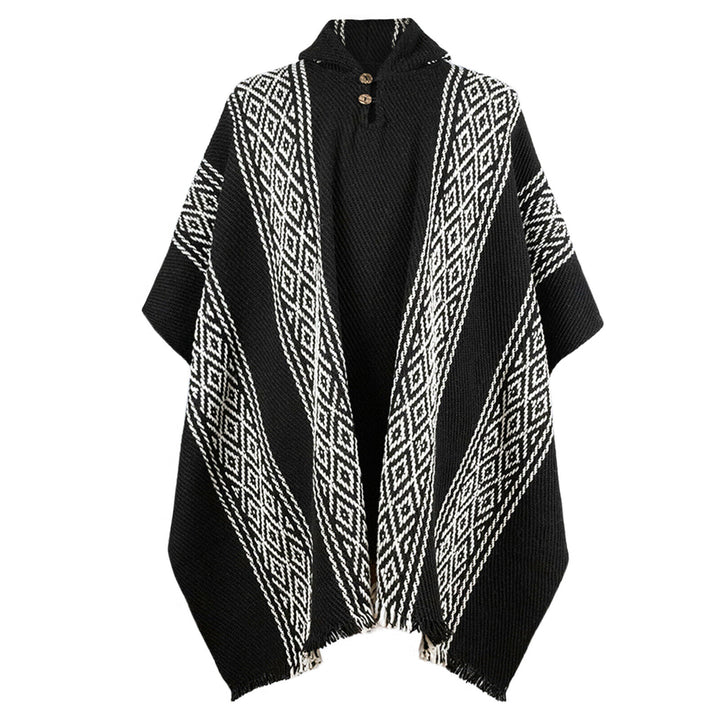 A black poncho showcases white diamond patterns and wooden buttons at the collar, displayed against a plain white background.