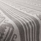 The image shows a close-up of a woven fabric with geometric patterns in white and gray. The design features parallel stripes and decorative shapes, creating a textured, linear appearance.