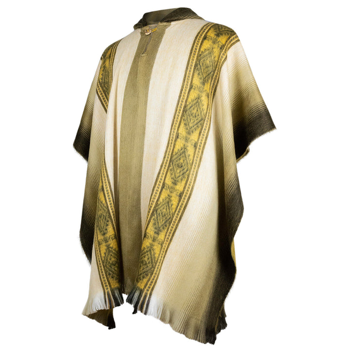 Poncho with vertical stripes and geometric patterns, featuring yellow and green hues. It hangs in a relaxed manner, exhibiting fringe details along the edges.