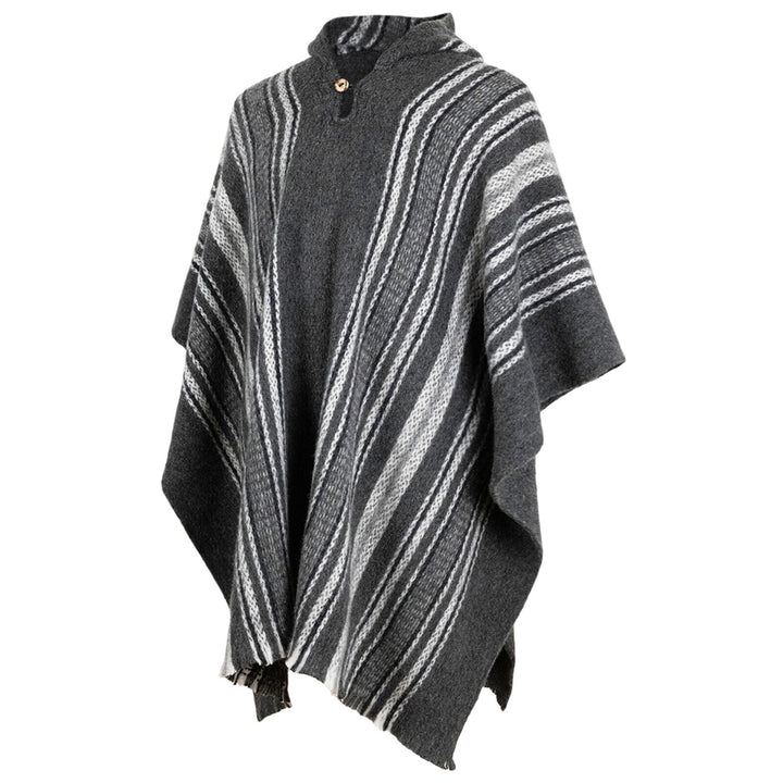 A woolen poncho featuring gray and black stripes with a high collar and wooden button, drapes elegantly against a plain white background, emphasizing its cozy texture and design.