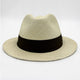 A straw fedora hat with a black band sits against a plain white background, highlighting its woven texture and classic design.