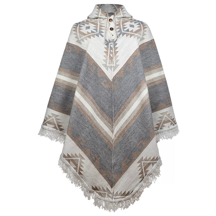 A patterned poncho with geometric designs and fringe trim lies flat, featuring a high collar with three buttons, displayed against a white background.