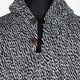 A knit sweater with a black-and-white pattern fastens with two coconut shell buttons; displayed on a black mannequin against a plain white background.