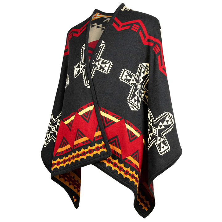 Poncho with tribal patterns; features black, red, and white geometric designs, including crosses and zigzags. The garment hangs open for wear, displaying vibrant, bold artwork.