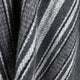 A textured woolen fabric displays diagonal stripes in varying shades of gray and white, creating a patterned surface. The close-up view highlights the softness and detail of the fibers.