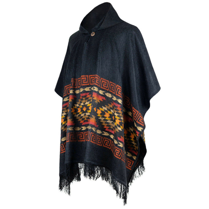 Poncho drapes on a white background, featuring a black base, colorful geometric patterns in red and yellow, and fringe trim at the bottom. It has a high collar fastened with a button.