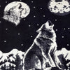 A wolf howls at the moon in a night scene, surrounded by stars and mountains. Another wolf head appears within a second moon, enhancing the wilderness setting.