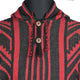 A garment featuring a black and red woven pattern with a hood and wooden buttons is displayed on a black mannequin torso.