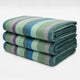 Imbabura baby alpaca wool blanket – three folded blankets featuring pastel-colored stripes in shades of green, blue, and purple are stacked neatly on a plain white background