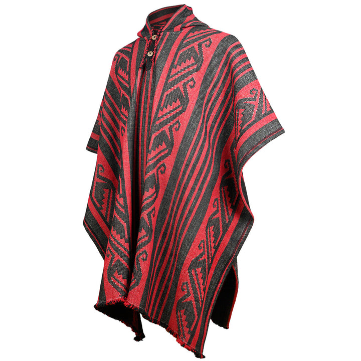 A red and black poncho displays intricate geometric patterns, draped over an invisible form, against a plain white background.