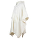A cream-colored poncho hangs, featuring a loose fit, front pocket, and frayed hem, with a small zippered collar, set against a plain white background.