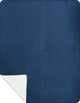 A blue fabric square overlays a lighter blue layer, with its bottom corner folded to reveal the white underside, contrasting against a dark background.