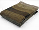 Alpaca wool queen blanket – a folded woolen blanket displays green and brown hues in a rectangular pattern. It rests on a white surface, showcasing a soft and textured appearance