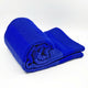 Chibuleo baby alpaca wool blanket – a bright blue, fluffy blanket is neatly rolled and partially folded. It is positioned against a plain white background, emphasizing its vibrant color and texture