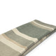 Deleg baby alpaca wool blanket – a folded, striped fabric lay on a plain white background, displaying broad, alternating green, beige, and cream stripes