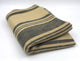 Chalua baby alpaca wool blanket – a folded, beige blanket with dark gray stripes lies flat against a plain white background