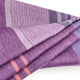 Chuquipata baby alpaca wool blanket – a folded, purple wool blanket features alternating light and dark stripes, including thin orange accents, resting on a plain white background
