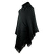 A black knitted poncho with a hood and front pocket drapes, featuring fringe edges, against a plain white background.