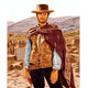 Clint Eastwood alpaca wool poncho – a man wearing a cowboy hat and a brown poncho holds a gun, standing confidently in a rugged desert landscape with distant hills under a bright sky