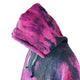 Hoodie with a vibrant pink and black tie-dye pattern rests on a white background, featuring green drawstrings hanging down from the neckline.