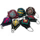 Colorful face masks with geometric patterns are displayed on a white background. Each mask has a unique design featuring vibrant colors like red, yellow, blue, and green, with black ear loops.