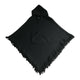 A black fabric poncho features a hood, a central pocket, and fringed edges. It lies flat on a plain white background.