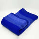Chibuleo baby alpaca wool blanket – a folded, striped blue blanket rests on a plain white surface, showcasing multiple shades of blue transitioning from dark to light