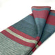 Atacazo baby alpaca wool blanket – a folded wool blanket features bold horizontal stripes in red, dark green, and gray, lying on a plain white background