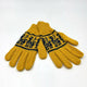 A pair of mustard-yellow knitted gloves with dark blue decorative patterns lie flat against a plain white background.