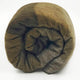 Alpaca wool queen blanket – a rolled-up, woolen blanket displays a pattern of brown and earthy tones, set against a plain white background