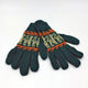 Green knitted gloves featuring a pattern of beige deer and orange accents, lying flat on a white surface.