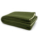 A folded green wool blanket rests neatly on a plain white background, showing its soft texture and layered edges. No text is present.