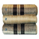 Quisapincha baby alpaca wool blanket – three rolled-up blankets lie stacked, each with a plaid pattern in shades of beige and gray. The blankets are numbered with blue digits: 1, 2, and 3