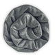 Suncamal baby alpaca wool blanket – a thick, gray, knitted fabric is tightly rolled into a circular, spiral shape, resembling a rose, set against a plain white background